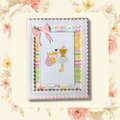 Handmade stork and bear baby girl new baby greeting card with pink bow, white scalloped border and colourful striped patterned papers on blush floral background