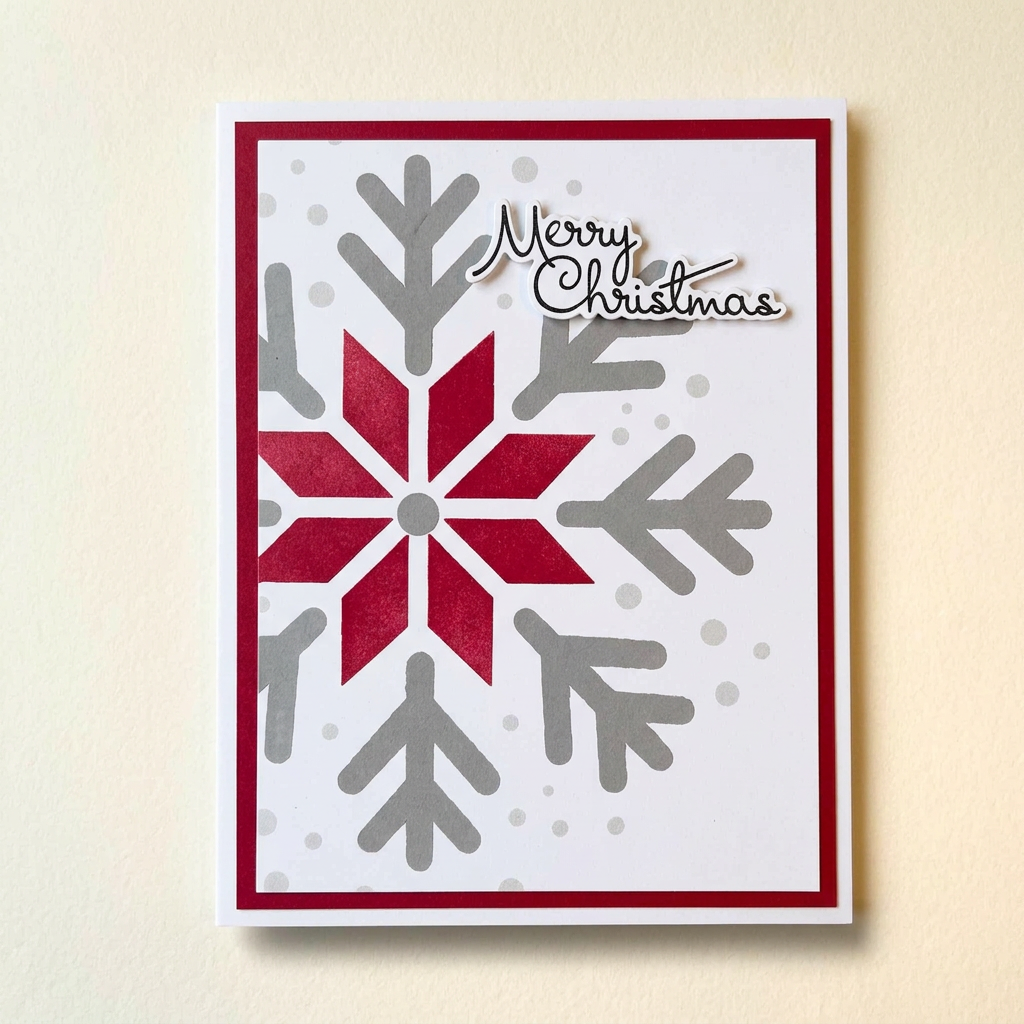 Hand-inked red and grey large snowflake Merry Christmas greeting card with a red border.