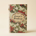 Vintage Rustic Christmas Journal standing upright on a cream background