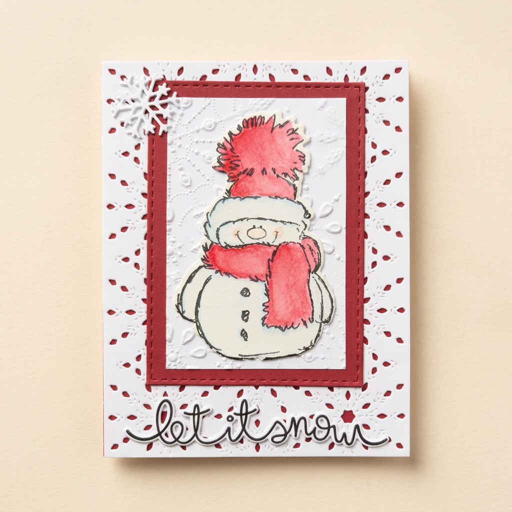 Red snowman Let It Snow greeting card with embossed white layers and snowflake details on a cream background.