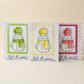 Set of three Let It Snow snowman Christmas greeting cards in green, yellow and red on a warm cream background.
